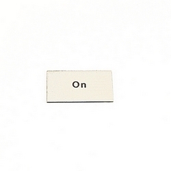 Brushed aluminum on black plastic legend plate insert with &quot;On&quot; text and 22mm mounting size
